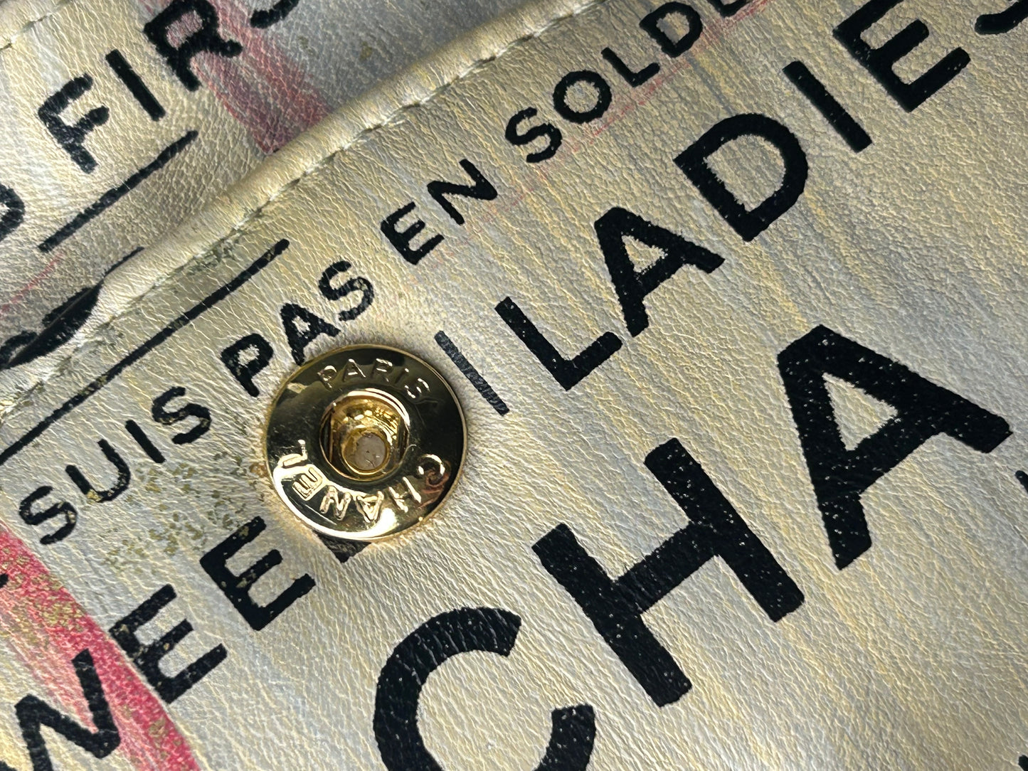 CHANEL Graffiti Newsprint Logo Medium Double Flap Lambskin Handbag Beige